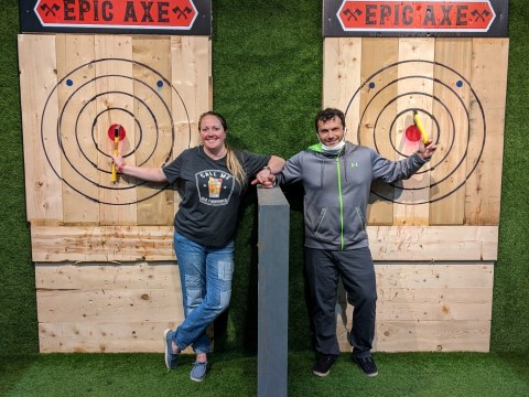Allison Kimmey holding a sign posing for the camera