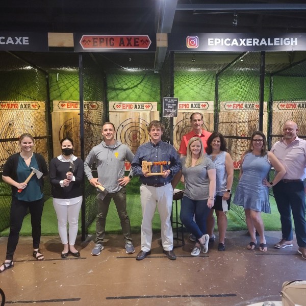 a group of people standing in front of a store