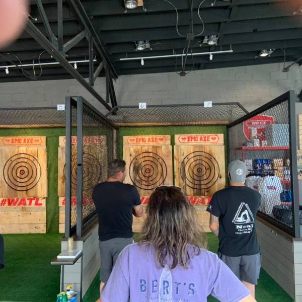 a group of people standing in front of a store