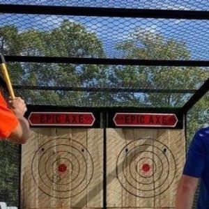 a person standing next to a fence
